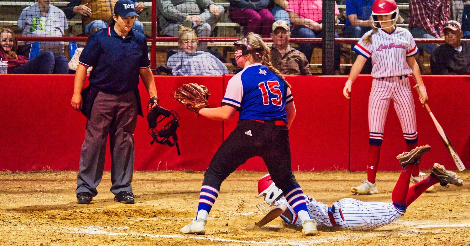 Abby Hallman steals home on a rare miscue by pitcher Kennedi Elmore, who threw twelve strikeouts in her no-decision, five-inning start. [pitcher pictures & more]